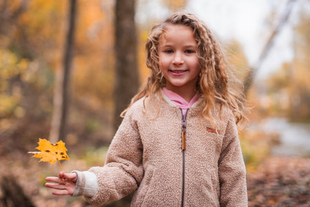 Child girl having fun on Autumn Forestの写真素材
