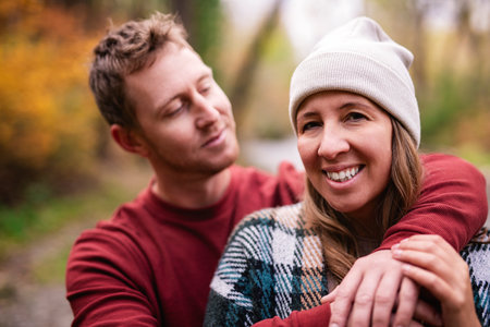 photo of harmony romantic couple in october autumn forest town parkの写真素材