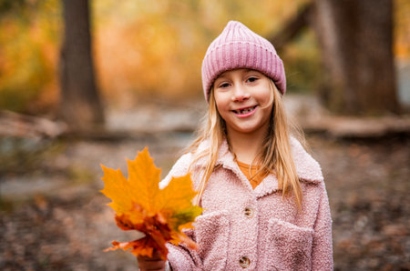 Child girl having fun on Autumn Forestの写真素材