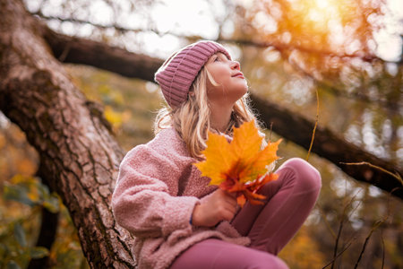 Child girl having fun on Autumn Forestの写真素材