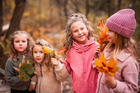 Group Of Young Children having fun on Autumn Forestの写真素材