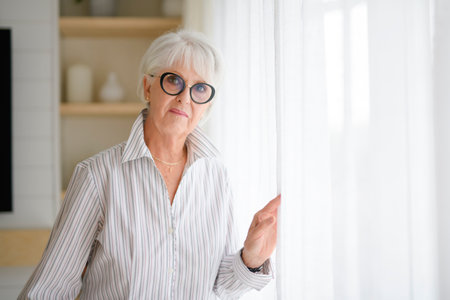 Portrait of elderly woman at home