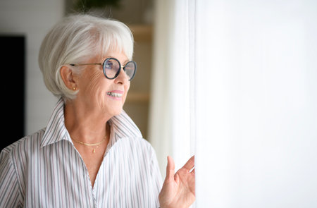 Portrait of elderly woman on living room at home