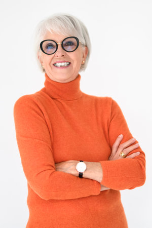 Portrait of elderly woman in eyeglasses over grey background.の写真素材