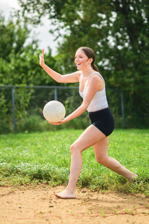 teen play volleyball in summer seasonの写真素材