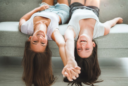 Two best girls having fun together on white studioの写真素材