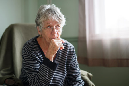 worried senior woman at home felling very bad