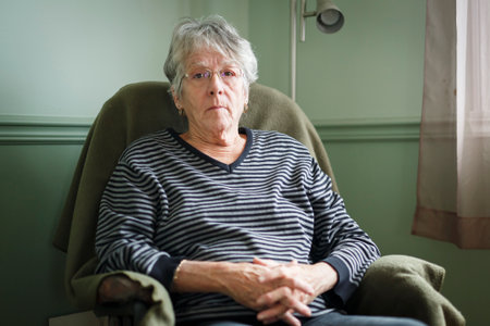 worried senior woman at home felling very bad