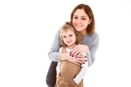 Mother and child daughter over white backgroundの写真素材