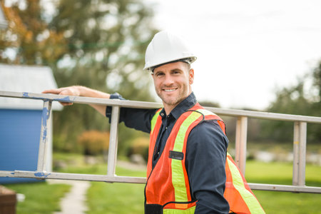 inspector or engineer with ladder checking the building structure and house roof specifications.