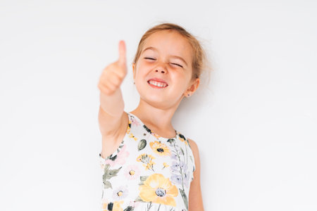 Cute girl 4-5 year old posing in studio