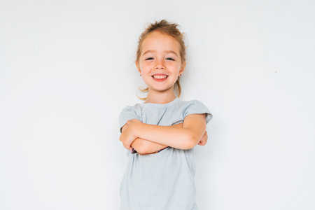 Cute girl 4-5 year old posing in studio