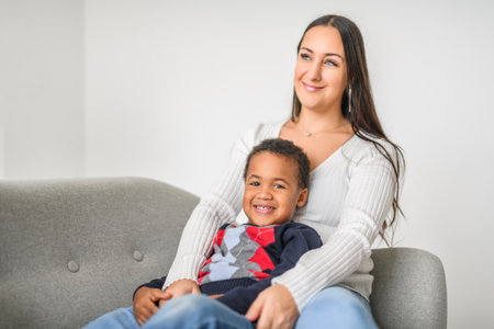 Mother with child son at home sofaの写真素材