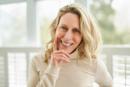 Nice portrait of casual woman at homeの写真素材