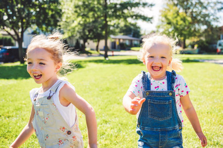 Happy kid having fun play together on summer seasonの写真素材