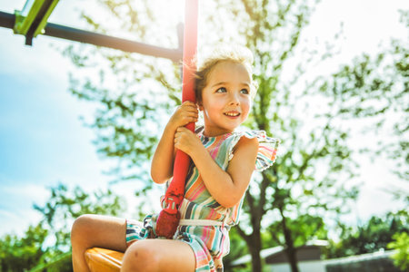 Happy 3 years old girl on a playground