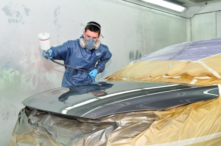 Worker painting a car の写真素材