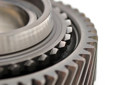 Detail of a sprocket isolated on white background の写真素材