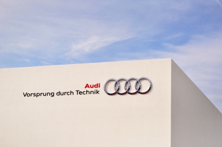 FRANKFURT - SEPTEMBER 21  Audi trademark and slogan on white building at the 65th Internationale Automobil Ausstellung  IAA  on September 21, 2013 in Frankfurt, Germany  のeditorial素材