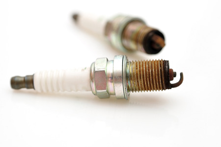 Single electrode used car sparks isolated on white の写真素材