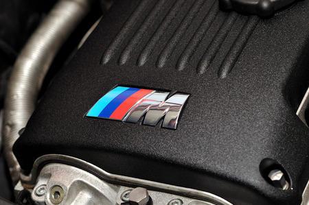 M-Power sign on to BMW engine cover.