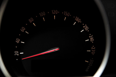 Car speedometer with black background and white digits.の写真素材