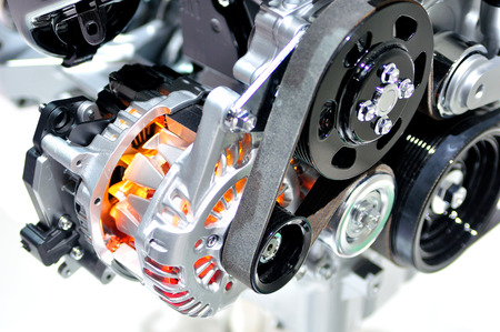 Very hot car alternator with drive belt.