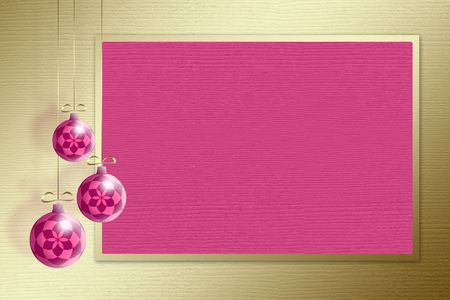 Three christmas spheres on a gold backgroundの写真素材