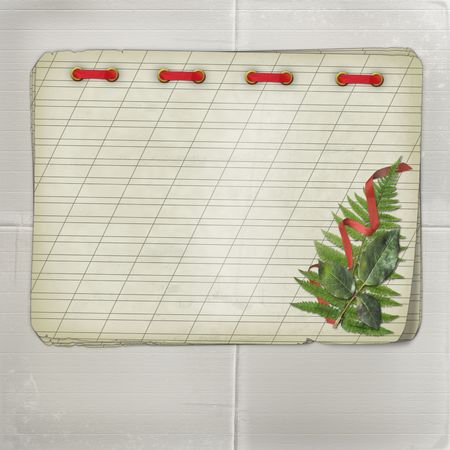 Old notebook with a bouquet on the grey backgroundの写真素材