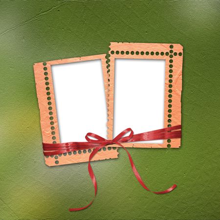 Old grunge frames with ribbons and bow on the abstract backgroundの写真素材