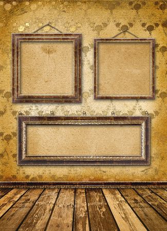Old gold frames Victorian style on the wall in the roomの写真素材