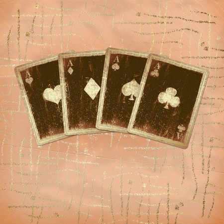 Grunge gold playing cards on the abstract background.