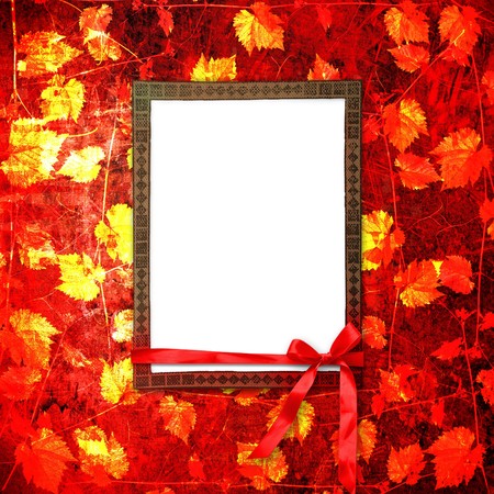 Grunge frame with bow and ribbon on the ancient vegetable backgroundの写真素材