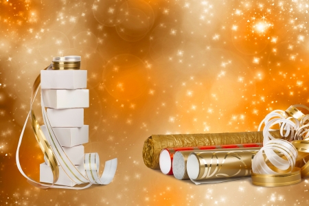 Gift boxes and rolls of wrapping paper with multicolored streamers for gifts on a beautiful bright backgroundの写真素材