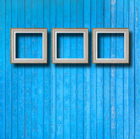 Vintage frame for picture on blue wooden wallの写真素材