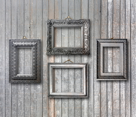 Vintage silver frame for picture on grey wooden wallの写真素材