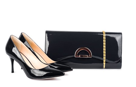 Beautiful black shoes with clutches on white isolated backgroundの写真素材