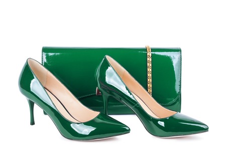 Beautiful green shoes with clutches on white isolated backgroundの写真素材