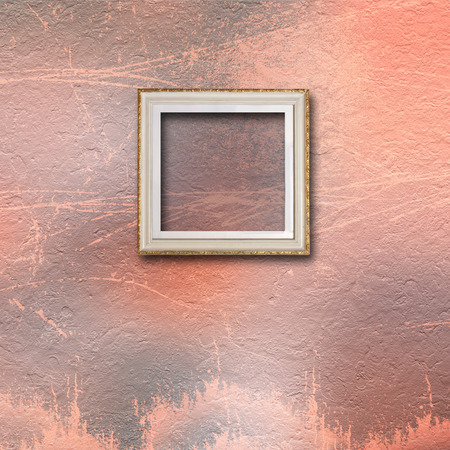 Interior of old room with wooden frames for pictures on stone wallの写真素材