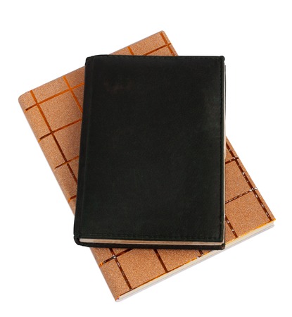 Notebook in black leather cover isolated on white backgroundの写真素材