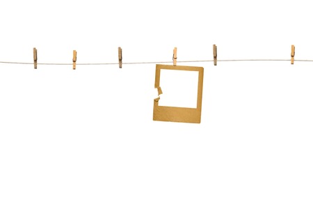 Old photoframes are hanging in the row  isolated on white backgroundの写真素材