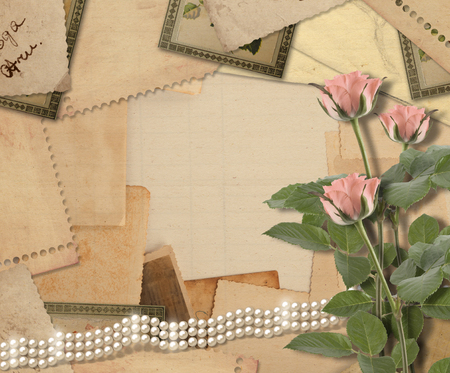Old vintage archive with photos, letters, pearls and pink rosesの写真素材