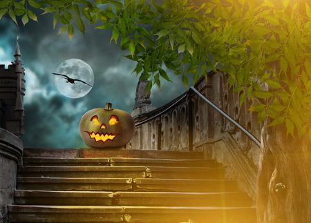Halloween pumpkins in yard of of old stone staircase night in bright moonlightの写真素材