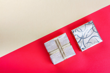 Golden gift box on  bright red background.Top view flat lay group objects