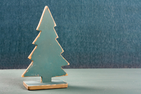 Old vintage wooden Christmas tree with spruce branches on the tableの写真素材