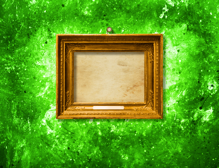 Old vintage multicolored ornate frame for picture on grunge stone wallの写真素材