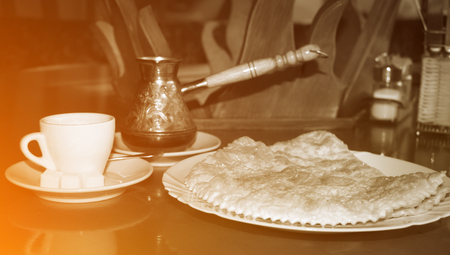 Hot Turkish coffee with fresh national traditional Caucasian pastriesの写真素材