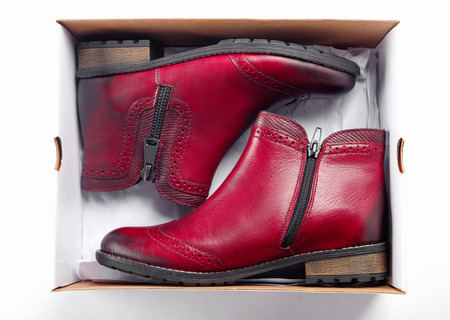 New beautiful fashion pink shoes in box in store on white shelf