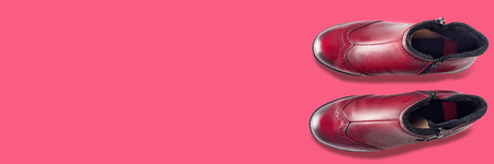 Fashionable beautiful pink scarf and sweater with trendy purple shoes on pink background. Top view flat lay group objectsの写真素材