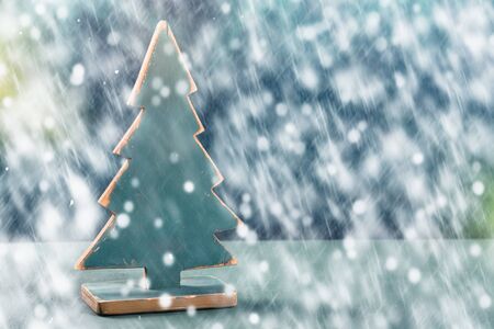 Old vintage wooden Christmas tree with spruce branches on the tableの写真素材